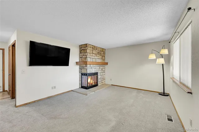 a view of an empty room with a flat screen tv