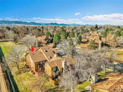 an aerial view of a house with a swimming pool