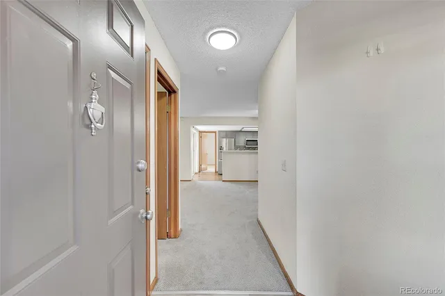 a view of hallway with livingroom