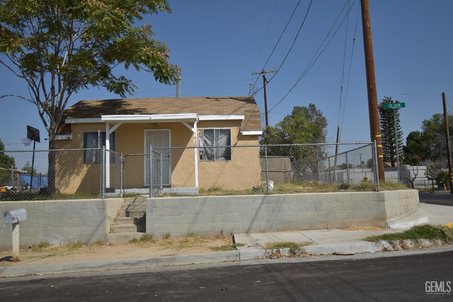 Undisclosed Address Bakersfield, CA 93305 - Photo 1 of 23 front view of a house