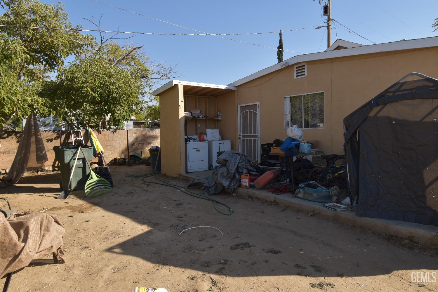 Undisclosed Address Bakersfield, CA 93305 - Photo 11 of 23 a view of a house with backyard