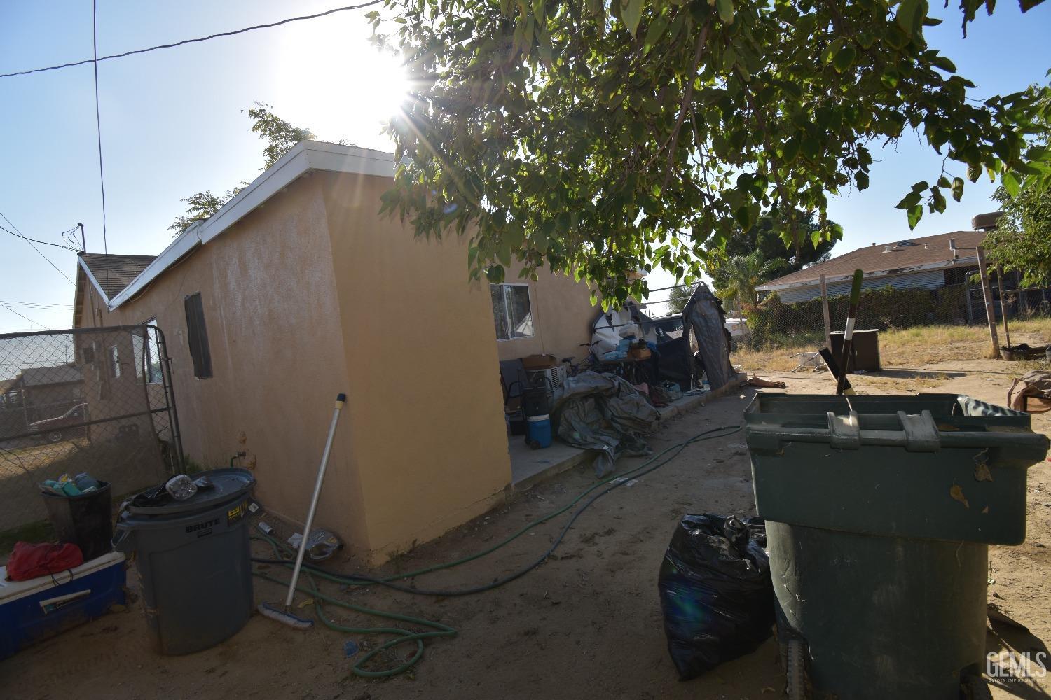 Undisclosed Address Bakersfield, CA 93305 - Photo 13 of 23 a backyard of a house with table and chairs