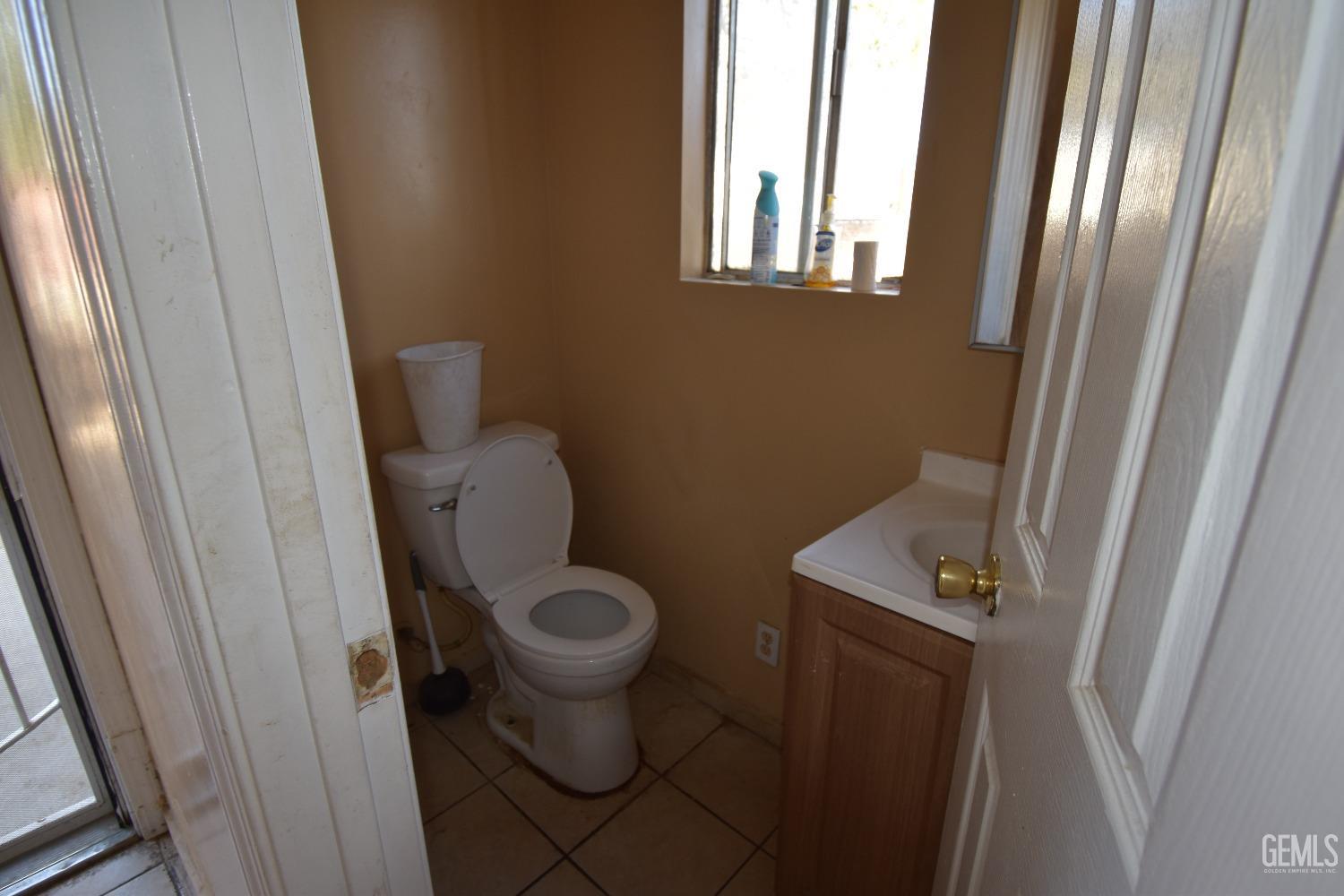 Undisclosed Address Bakersfield, CA 93305 - Photo 19 of 23 a bathroom with a toilet and a sink