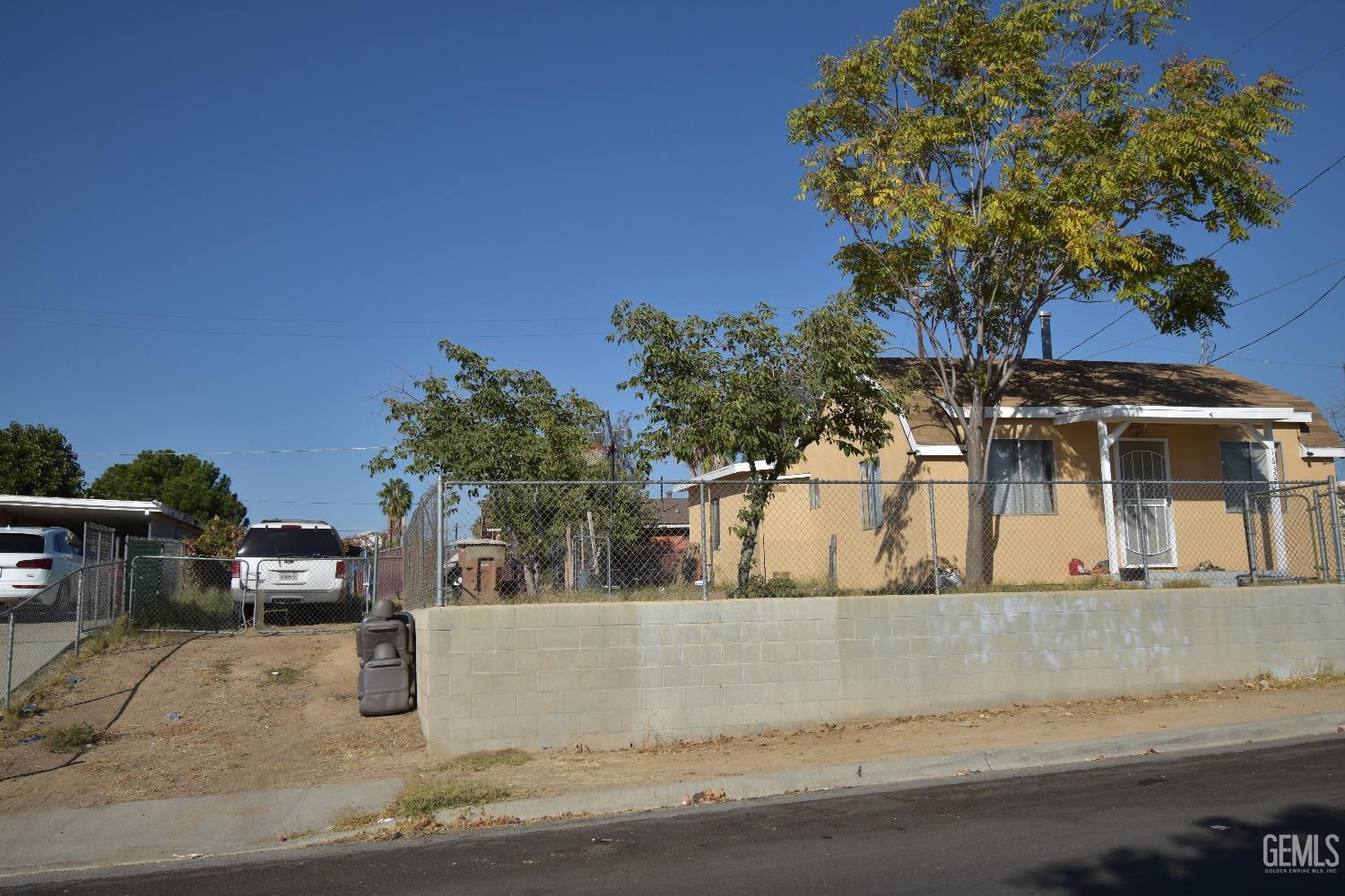 Undisclosed Address Bakersfield, CA 93305 - Photo 2 of 23 a view of a house with a tree