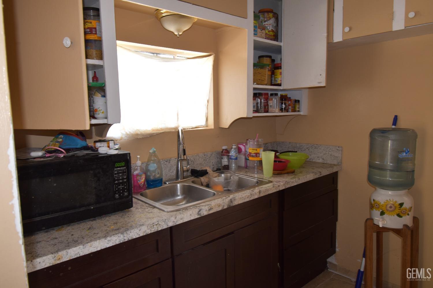 Undisclosed Address Bakersfield, CA 93305 - Photo 22 of 23 a bathroom with a sink double vanity and a mirror