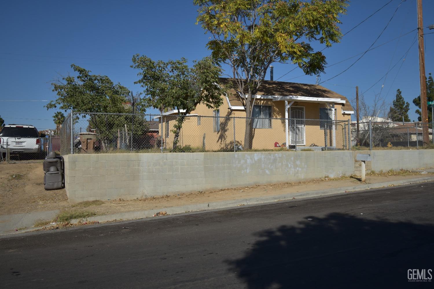 Undisclosed Address Bakersfield, CA 93305 - Photo 3 of 23 a view of a house with a yard