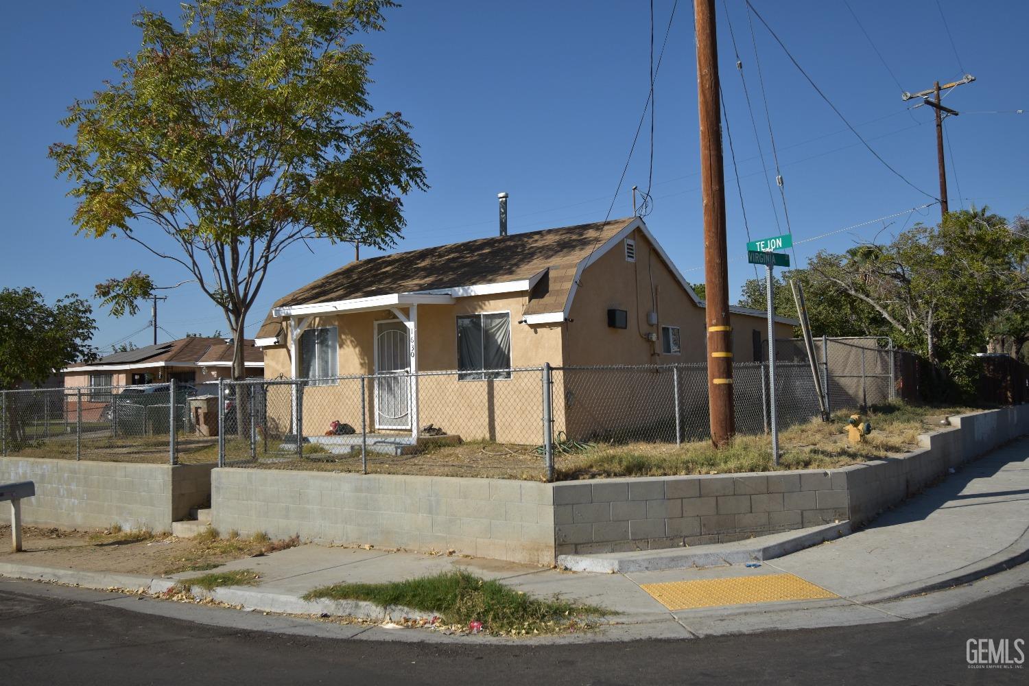 Undisclosed Address Bakersfield, CA 93305 - Photo 4 of 23 a front view of a house with garden