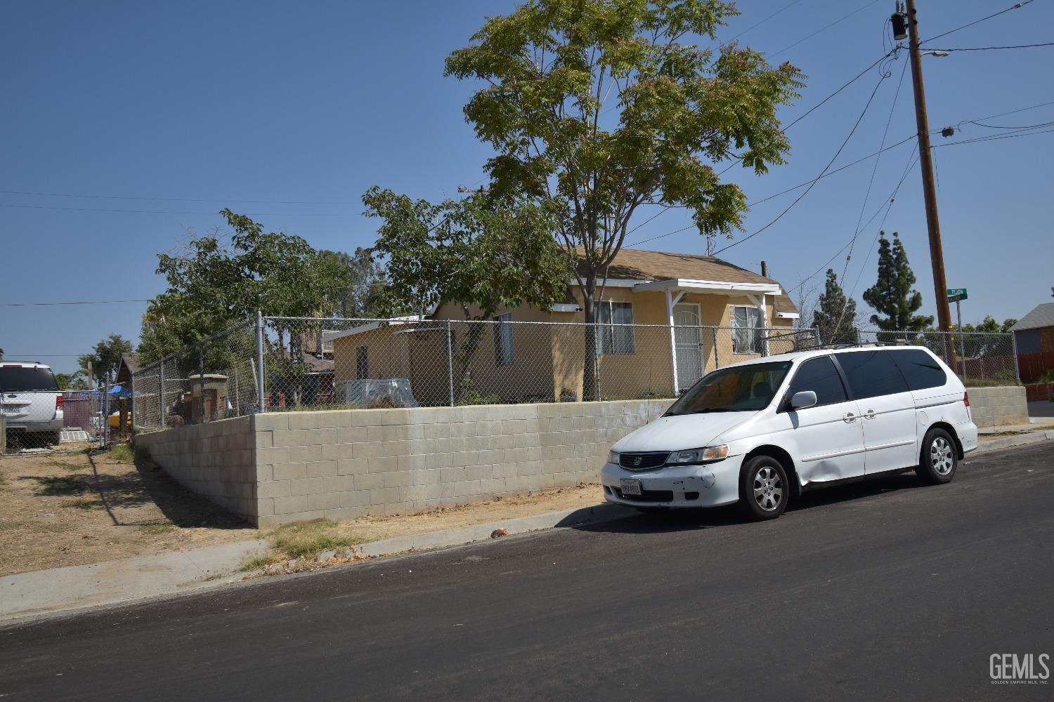Undisclosed Address Bakersfield, CA 93305 - Photo 5 of 23 a car parked in front of a house