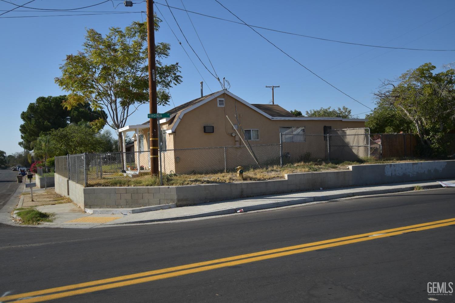 Undisclosed Address Bakersfield, CA 93305 - Photo 8 of 23 a view of a house with a street