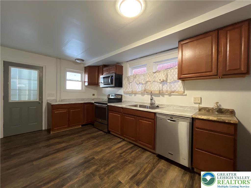 809 South 10th Street Allentown, PA 18103 - Photo 3 of 21 a kitchen with granite countertop stainless steel appliances and sink