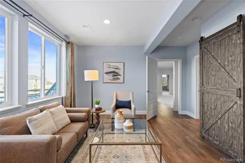 a living room with furniture or couch and a window