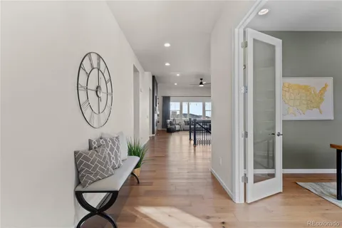 a living room with furniture and a mirror