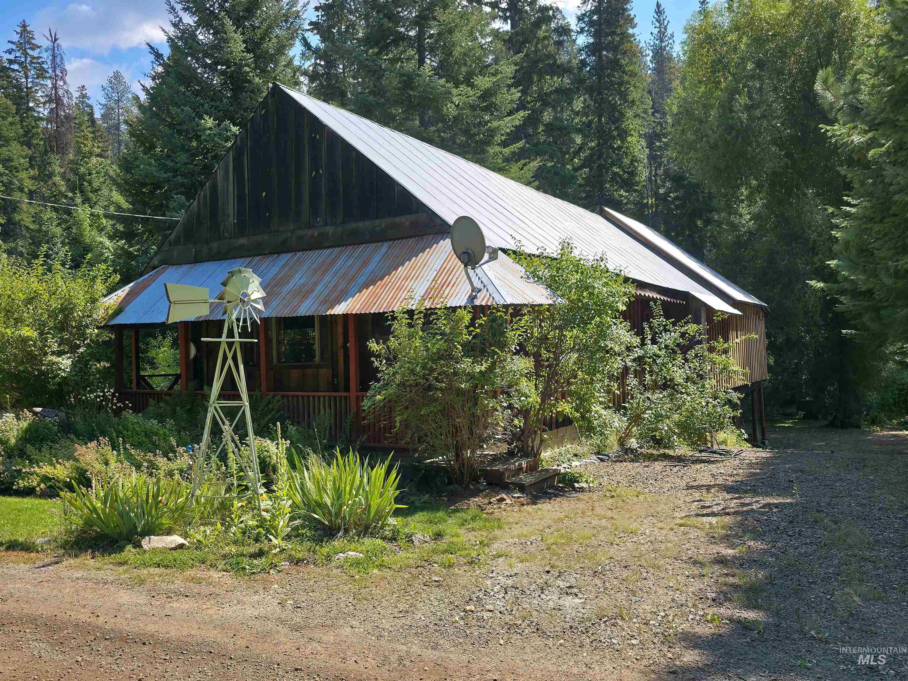 4482 Council Cuprum Road Council, ID 83612 - Photo 6 of 45 Chalet / cabin with a wooded view, a porch, and a metal roof