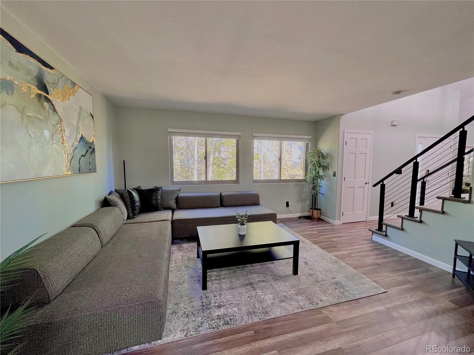 265 Caesar Road Black Hawk, CO 80422 - Photo 14 of 42 a living room with furniture and a potted plant