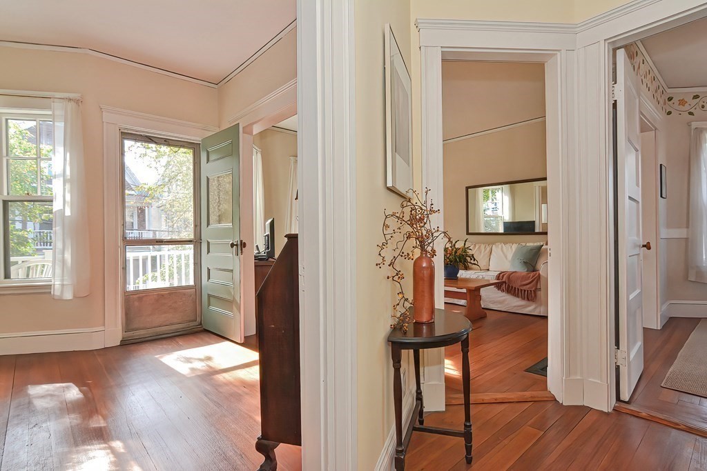 17-19 Walnut Road Somerville, MA 02145 - Photo 21 of 42 a living room with furniture and a wooden floor