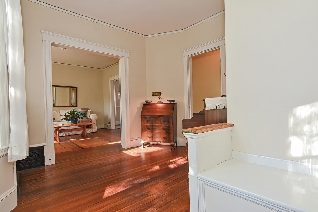 17-19 Walnut Road Somerville, MA 02145 - Photo 22 of 42 a living room with furniture and a wooden floor