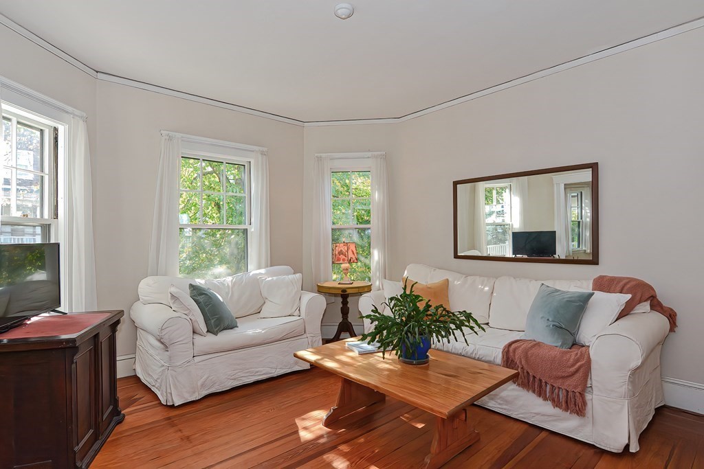 17-19 Walnut Road Somerville, MA 02145 - Photo 24 of 42 a living room with furniture and a large window