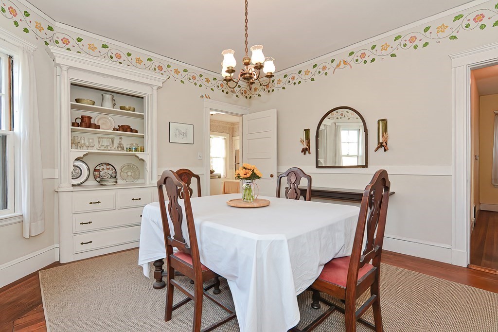 17-19 Walnut Road Somerville, MA 02145 - Photo 27 of 42 a view of a dining room with furniture and chandelier