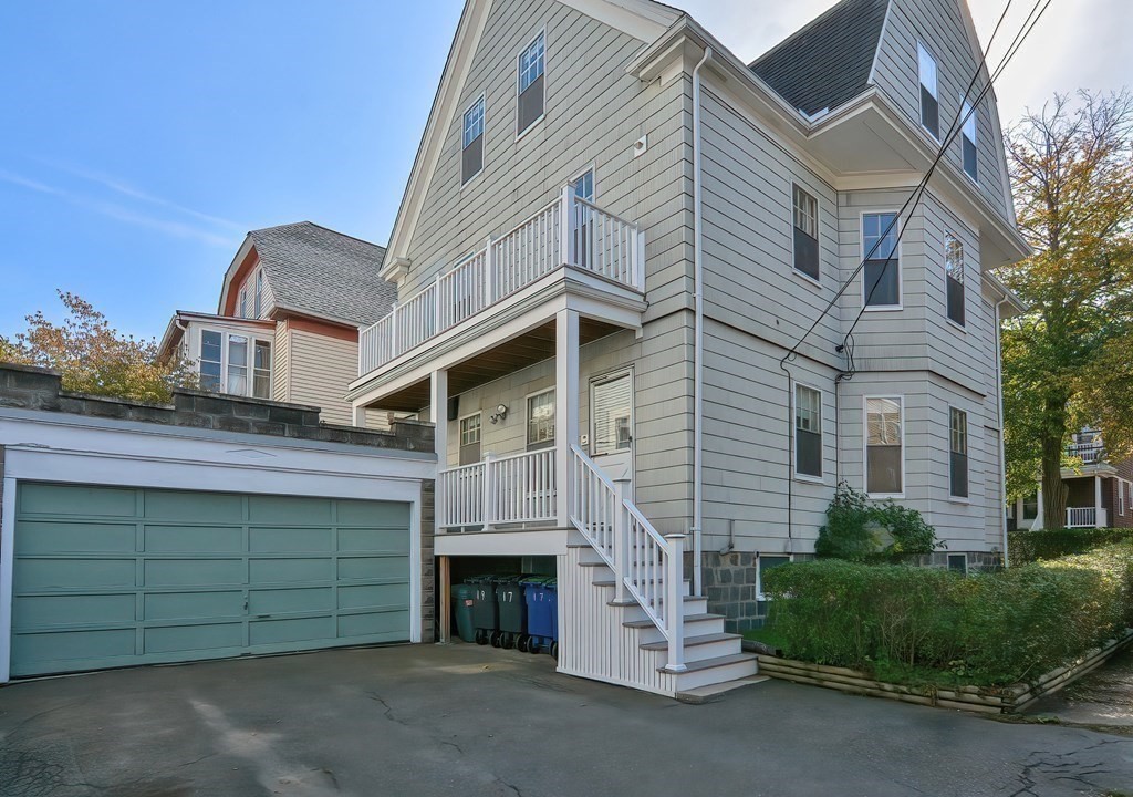 17-19 Walnut Road Somerville, MA 02145 - Photo 3 of 42 a view of a house with a garage