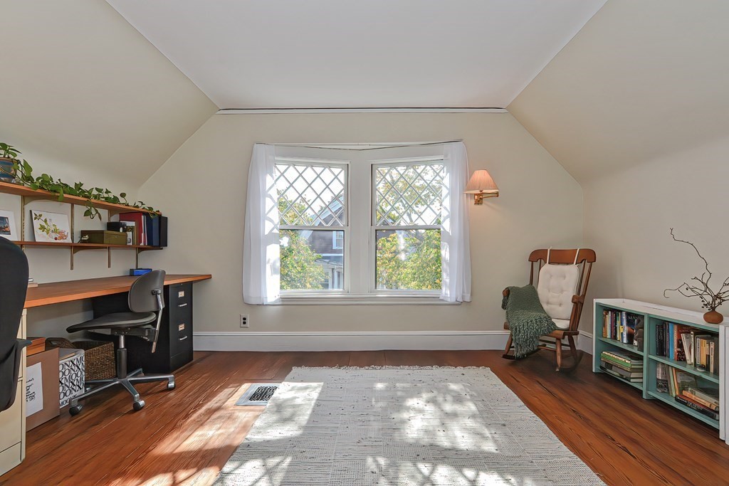 17-19 Walnut Road Somerville, MA 02145 - Photo 37 of 42 a view of a workspace with furniture and a window
