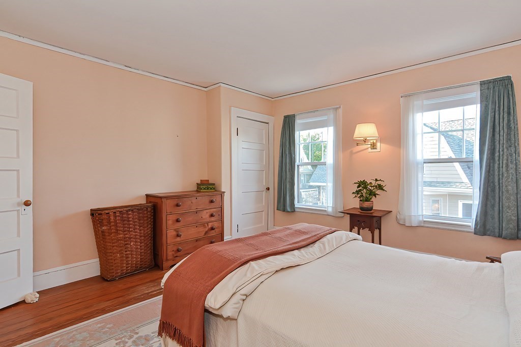 17-19 Walnut Road Somerville, MA 02145 - Photo 39 of 42 a bedroom with a bed and wooden floor