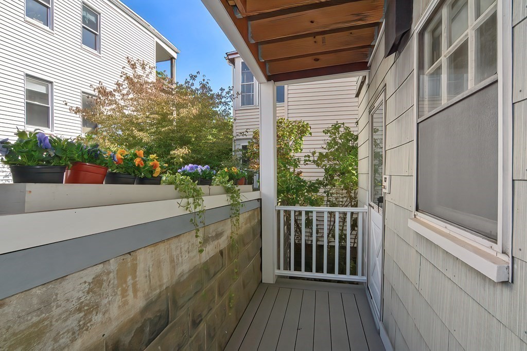 17-19 Walnut Road Somerville, MA 02145 - Photo 9 of 42 a view of a balcony with potted plants