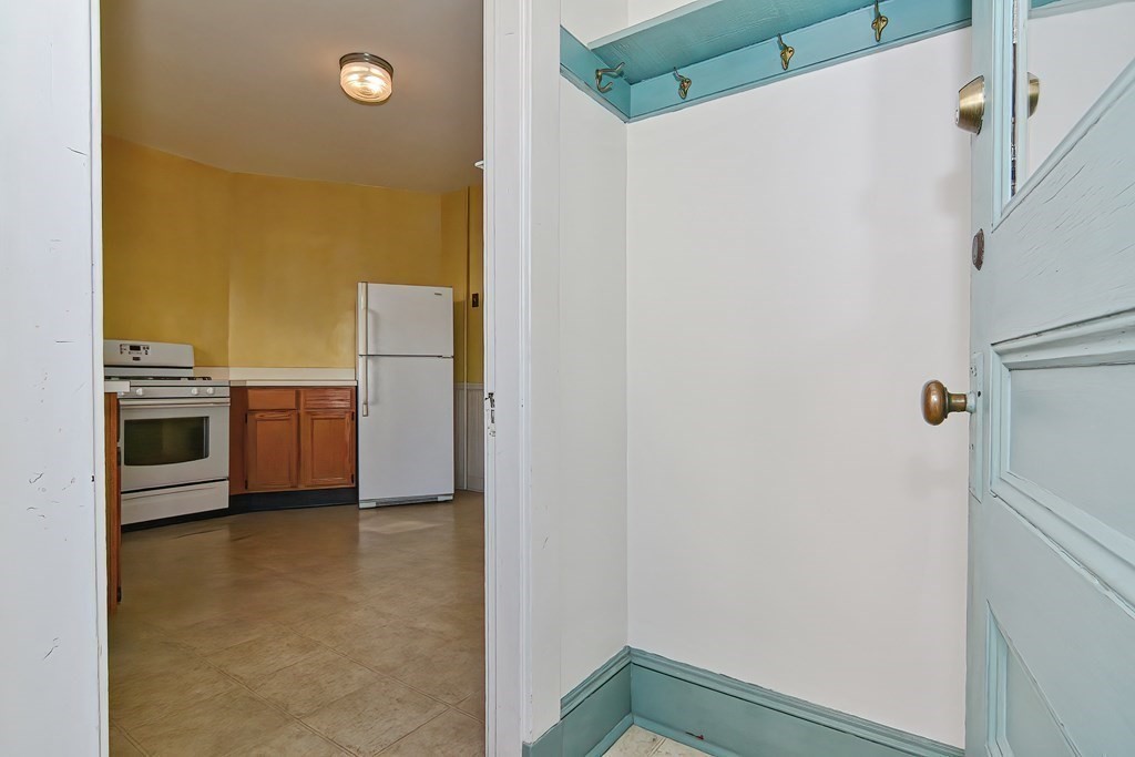 17-19 Walnut Road Somerville, MA 02145 - Photo 10 of 42 a view of a kitchen with a refrigerator