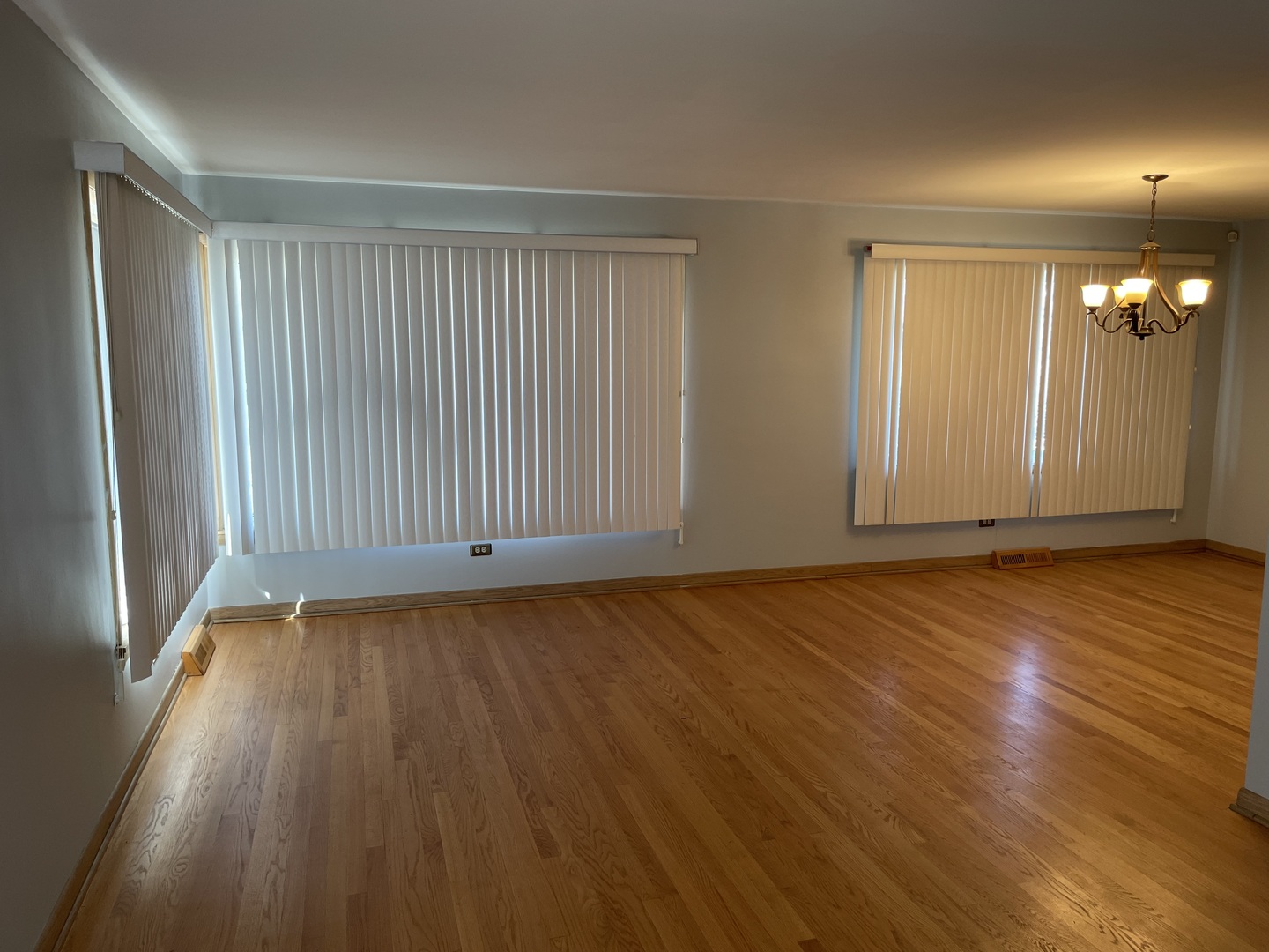 10335 Laporte Avenue Oak Lawn, IL 60453 - Photo 2 of 17 an empty room with wooden floor and windows