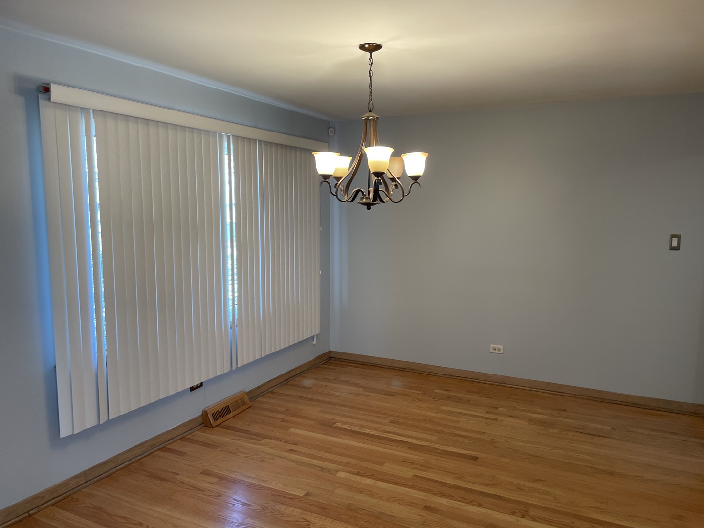 10335 Laporte Avenue Oak Lawn, IL 60453 - Photo 3 of 17 a view of a room with wooden floor fan and window