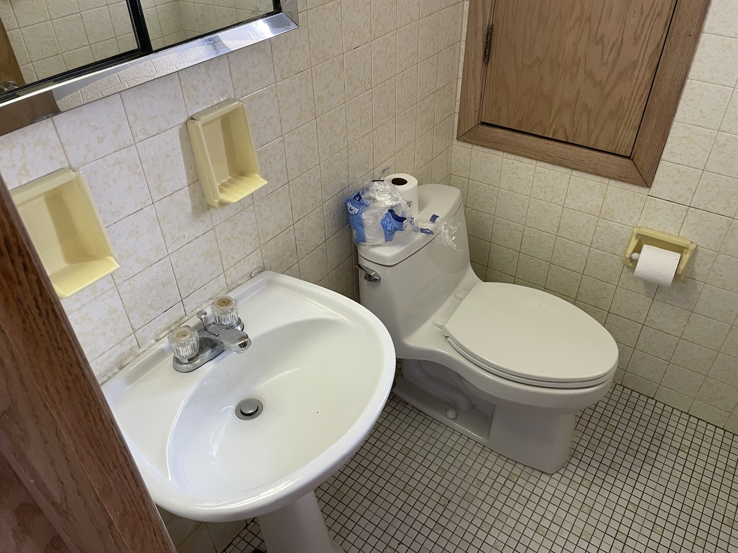 10335 Laporte Avenue Oak Lawn, IL 60453 - Photo 10 of 17 a white toilet sitting next to a bathroom sink