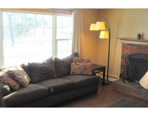 32 Juniper Lane Rutland, MA 01543 - Photo 2 of 21 a living room with furniture and a fireplace