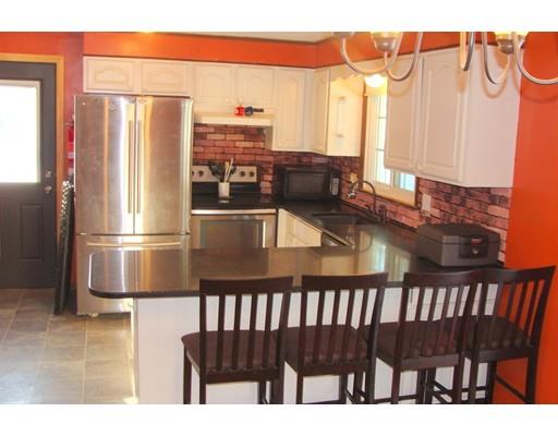 32 Juniper Lane Rutland, MA 01543 - Photo 4 of 21 a kitchen with stainless steel appliances a refrigerator and a table