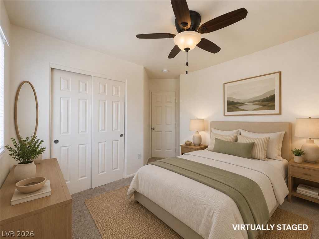 9456 Grandview Spring Avenue Las Vegas, NV 89166 - Photo 33 of 49 Virtually Staged. An inviting sleeping space with neutral tones, featuring a large closet and overhead illumination.