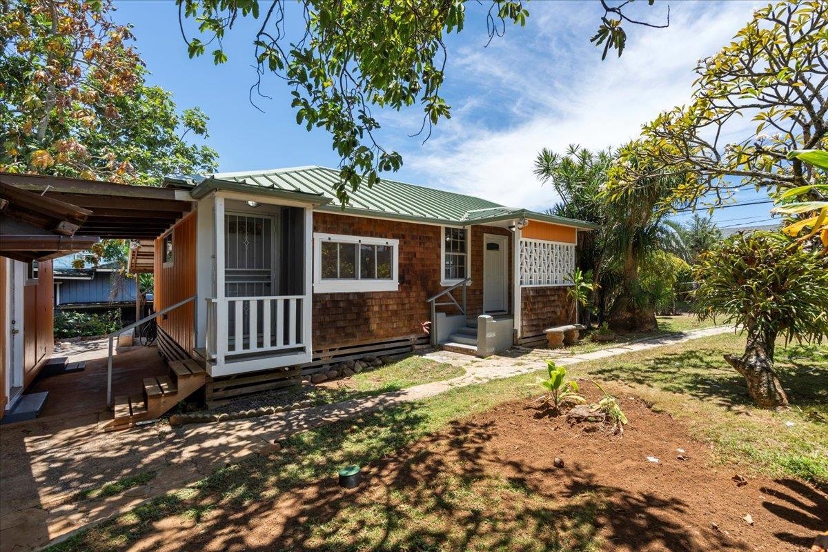 752 Noholani Street Haiku, HI 96708 - Photo 14 of 45 a front view of a house with garden