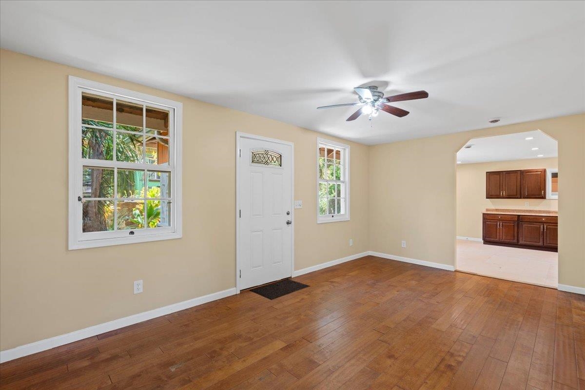 752 Noholani Street Haiku, HI 96708 - Photo 15 of 45 a view of an empty room with a window and a kitchen