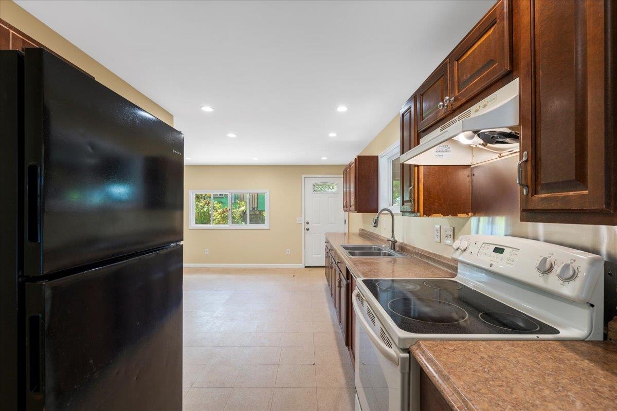 752 Noholani Street Haiku, HI 96708 - Photo 17 of 45 a kitchen with a stove and a sink