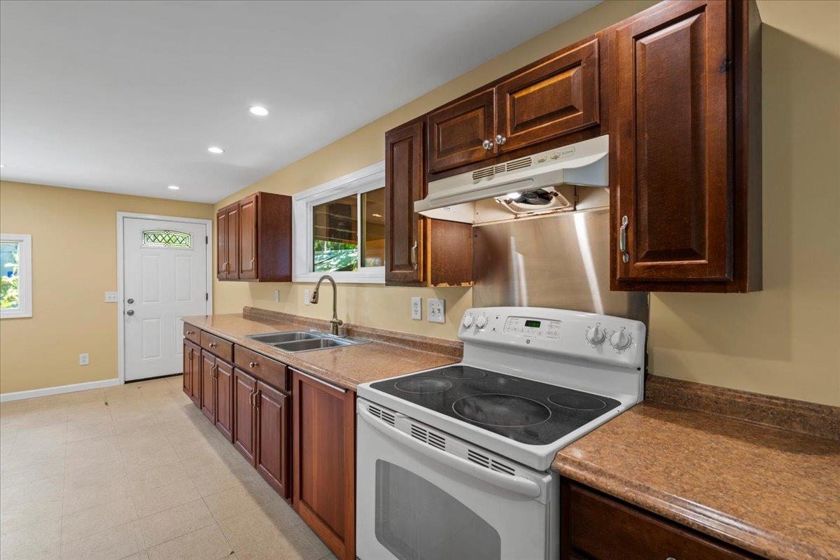 752 Noholani Street Haiku, HI 96708 - Photo 20 of 45 a kitchen with a sink and a stove top oven