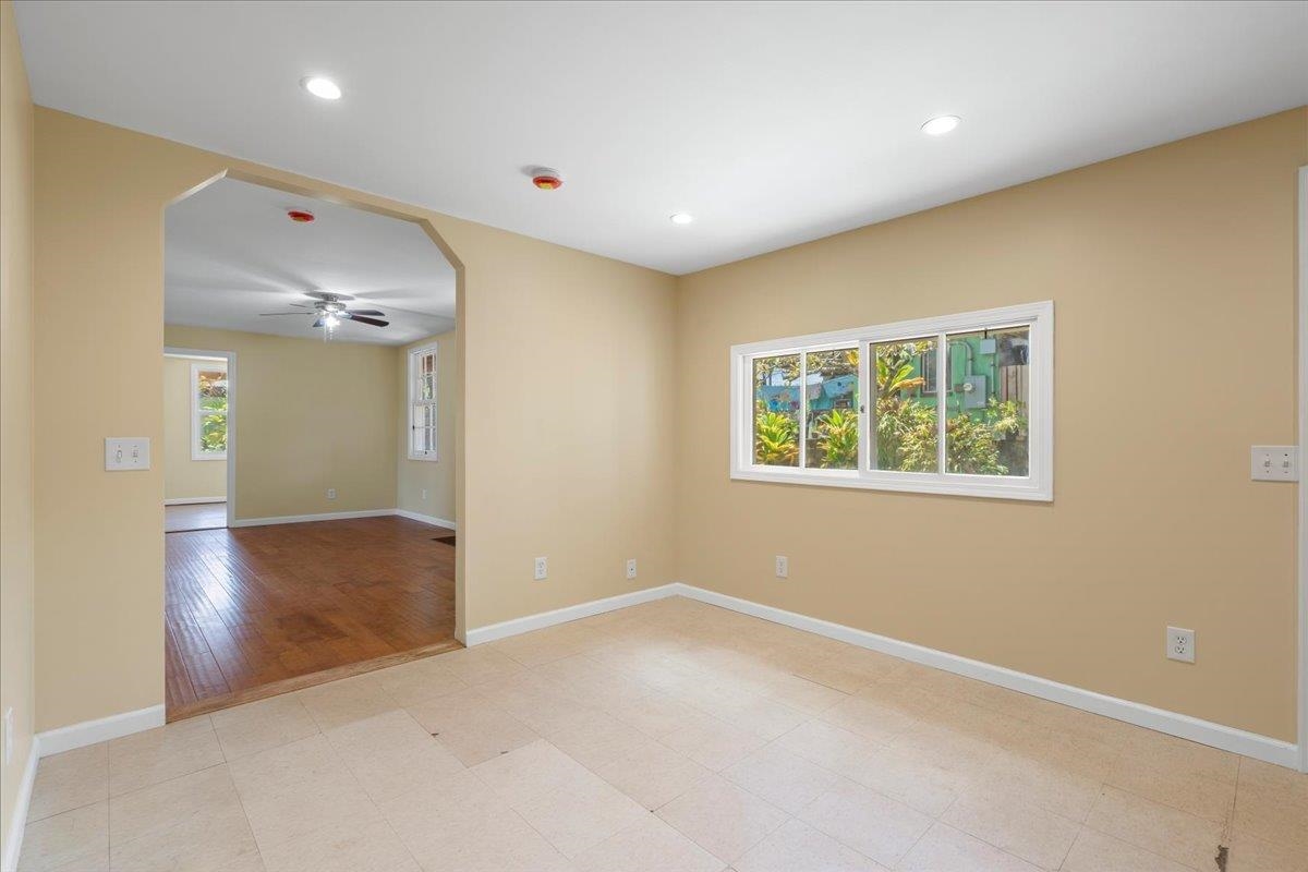 752 Noholani Street Haiku, HI 96708 - Photo 23 of 45 an empty room with wooden floor and windows