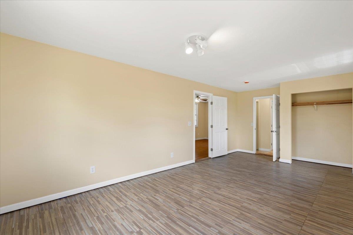 752 Noholani Street Haiku, HI 96708 - Photo 26 of 45 a view of an empty room with wooden floor