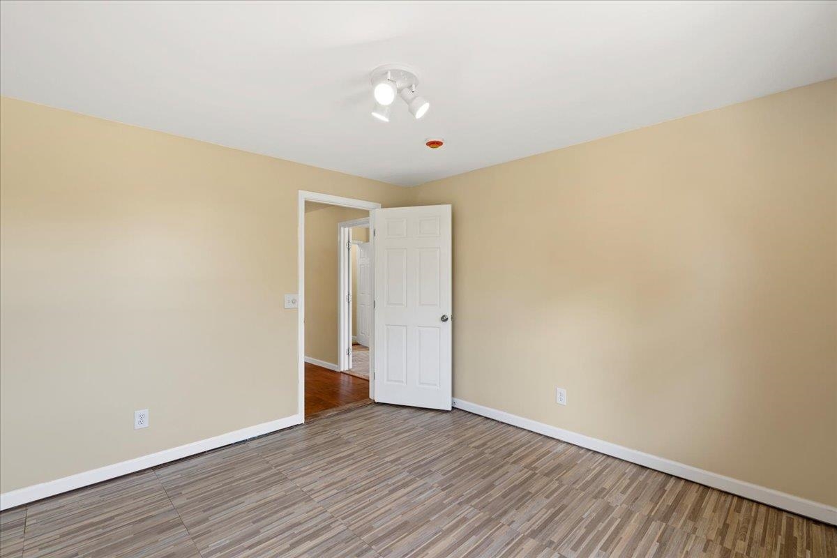 752 Noholani Street Haiku, HI 96708 - Photo 33 of 45 a view of an empty room with wooden floor