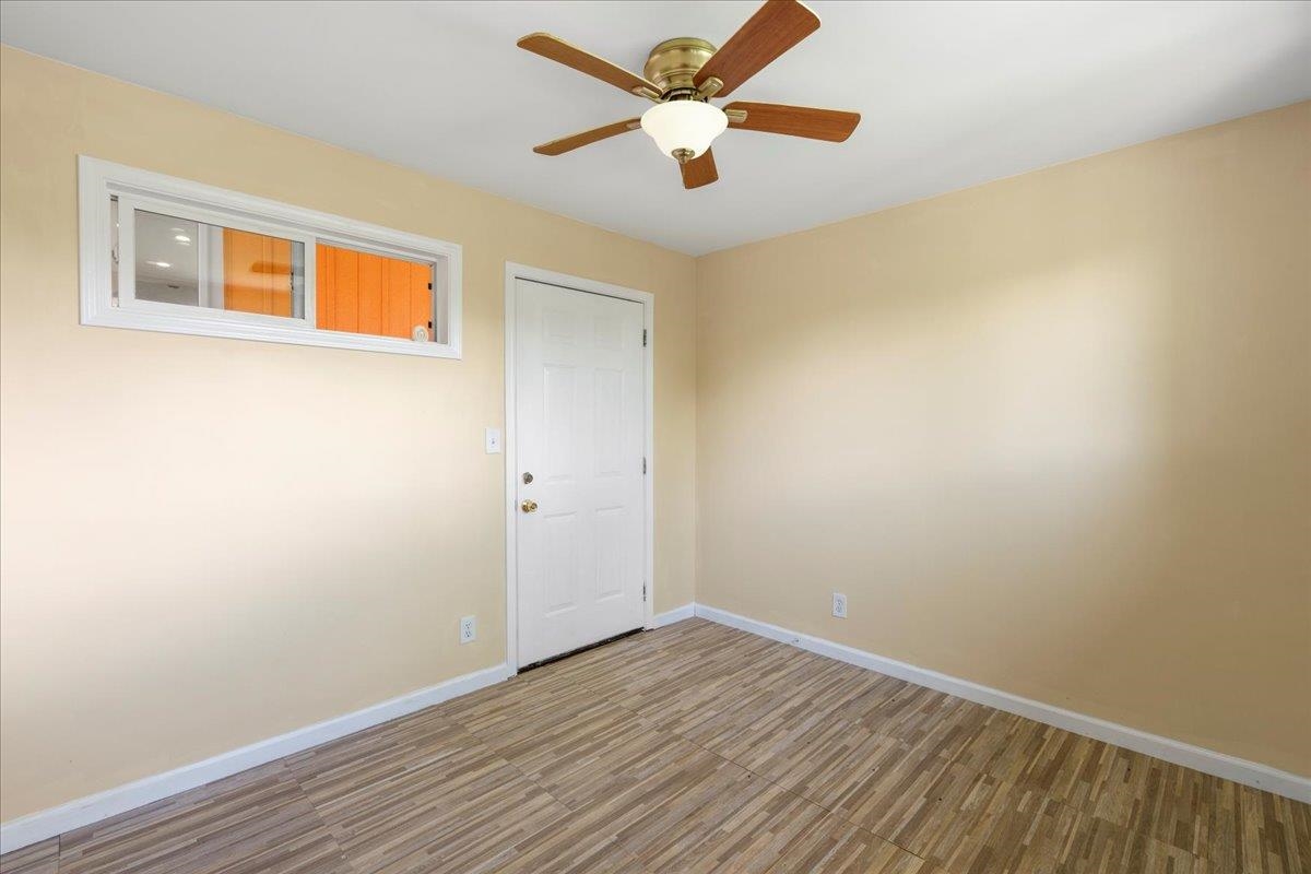 752 Noholani Street Haiku, HI 96708 - Photo 36 of 45 a view of an empty room with wooden floor