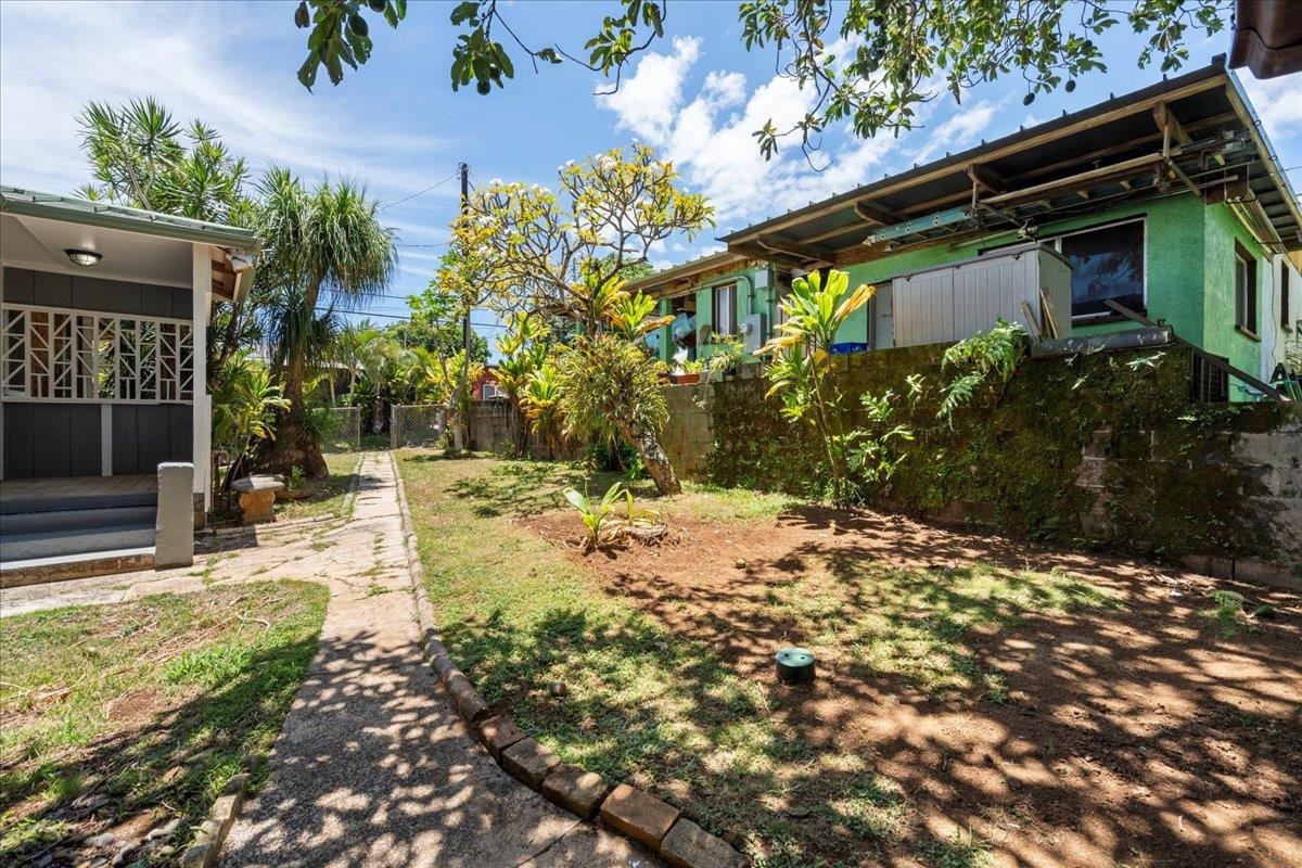 752 Noholani Street Haiku, HI 96708 - Photo 42 of 45 a view of a yard with plants and large trees