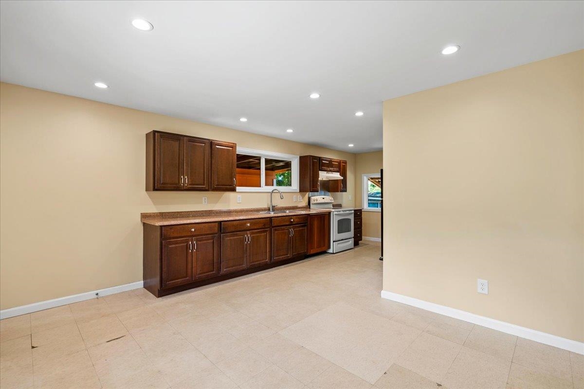 752 Noholani Street Haiku, HI 96708 - Photo 7 of 45 a large kitchen with a sink and stainless steel appliances