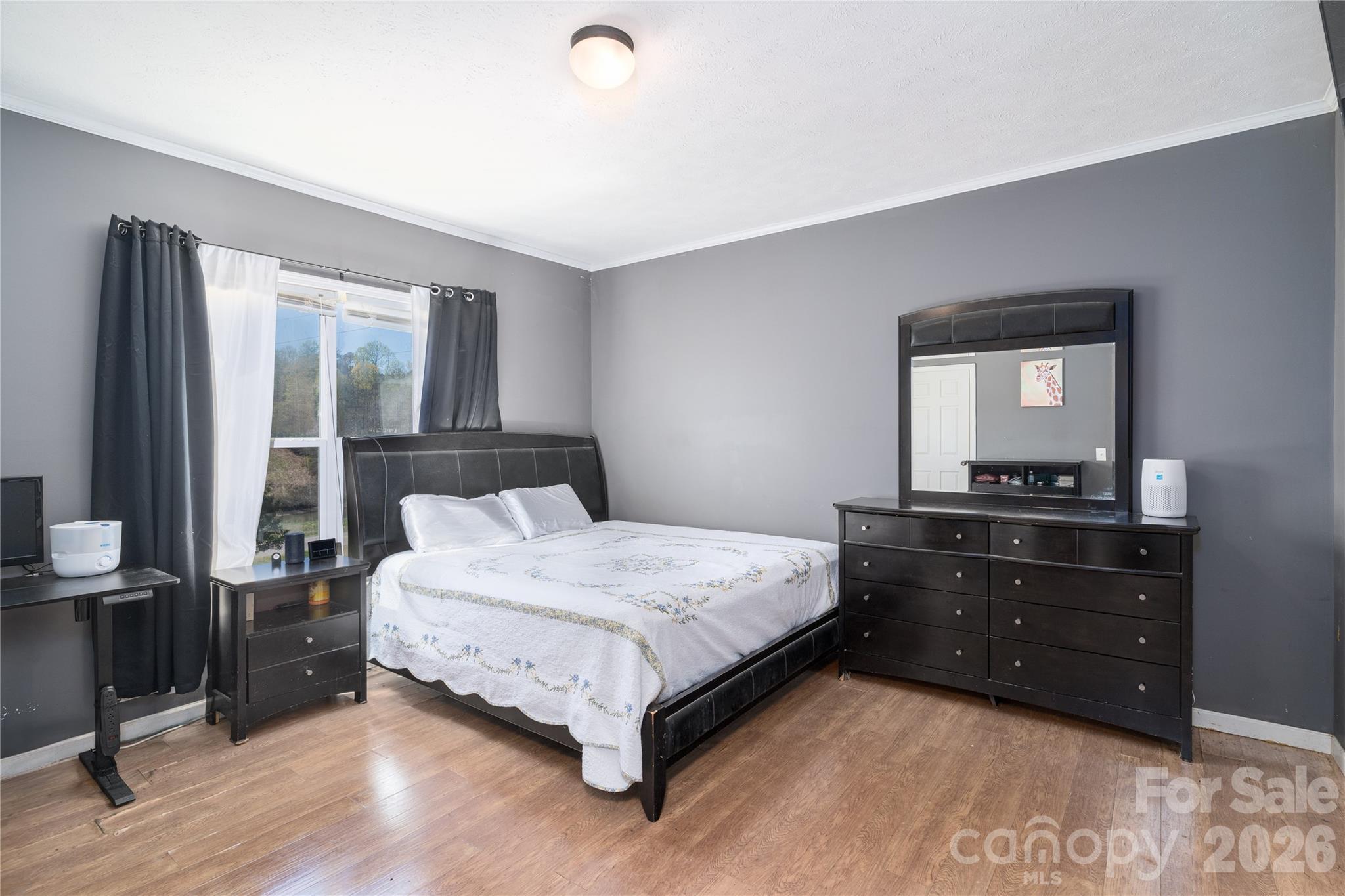296 Stillwater Road Troutman, NC 28166 - Photo 24 of 33 a bedroom with a bed and a window