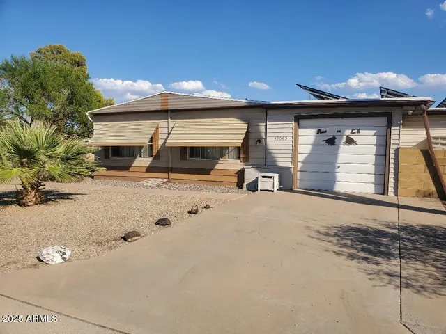 a front view of a house with parking
