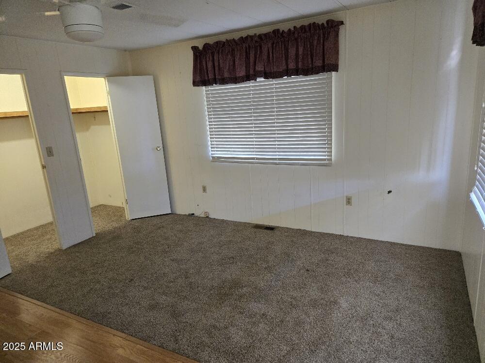 19065 North Dinero Road Sun City, AZ 85373 - Photo 27 of 37 a view of a room that has a window in it