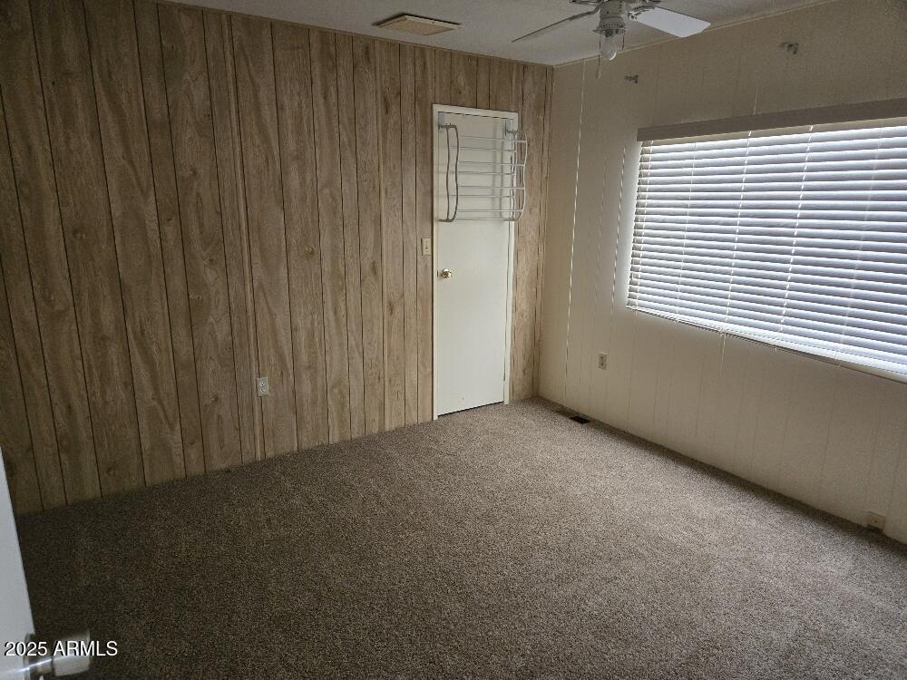19065 North Dinero Road Sun City, AZ 85373 - Photo 29 of 37 an empty room with a window