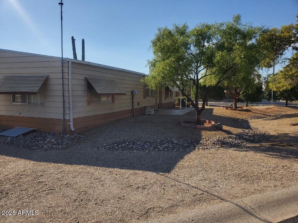 19065 North Dinero Road Sun City, AZ 85373 - Photo 5 of 37 a view of a house with a street
