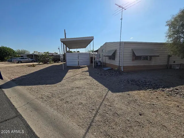 a view of a terrace with a table and chairs