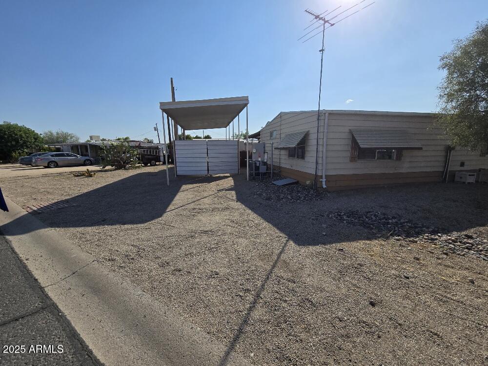19065 North Dinero Road Sun City, AZ 85373 - Photo 7 of 37 a view of a terrace with a table and chairs